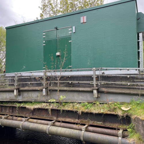 A kiosk being driven over a bridge