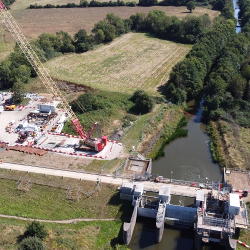 Gate being installed by a crane