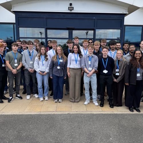 graduates and apprentices outside the office.
