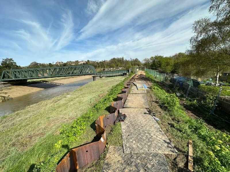 Piling in a field near a river.
