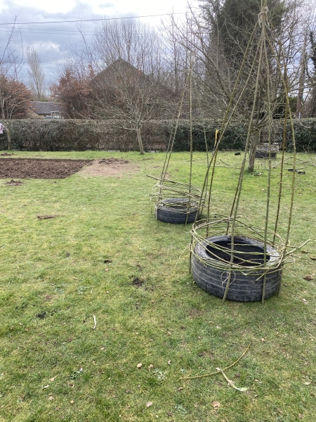 Donated tyres and sleepers as a seating area in school sensory garden