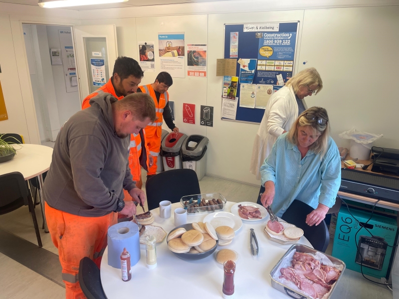 Men and women in a site cabin at a buffet