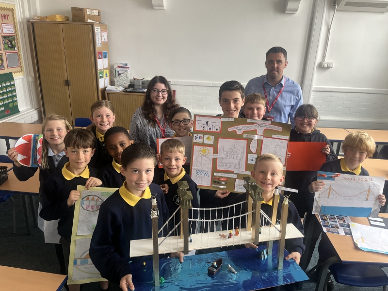 Children in a classroom with model bridges