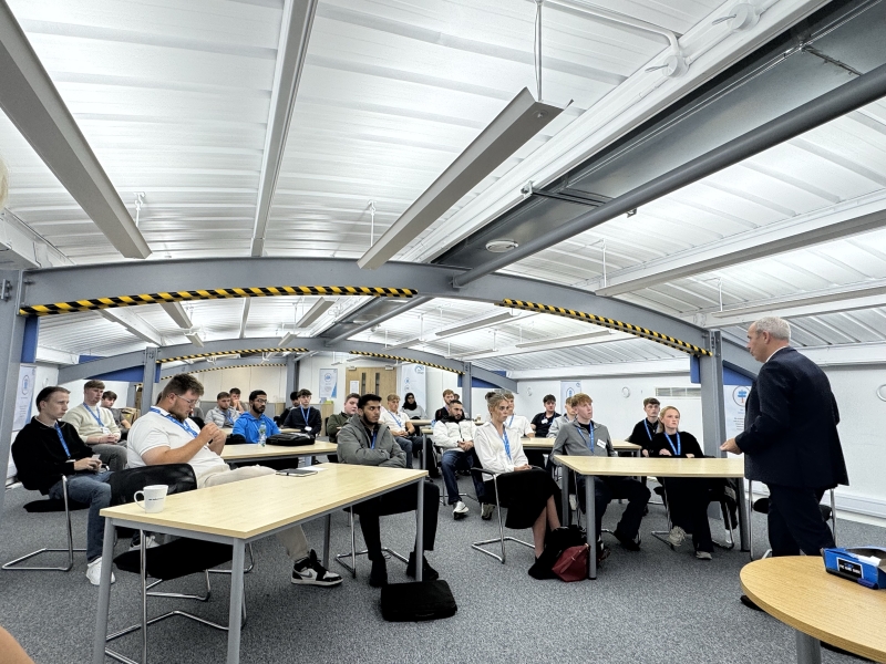 graduates and apprentices sat in the office.