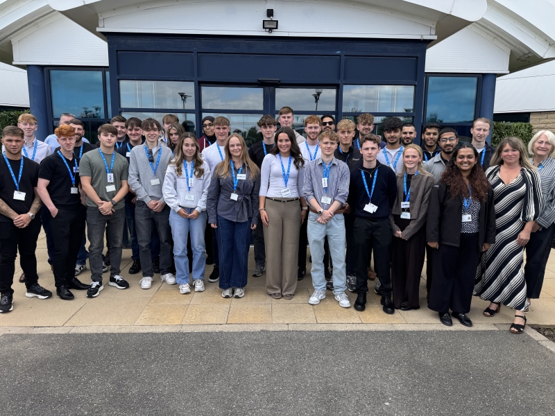 graduates and apprentices outside the office.