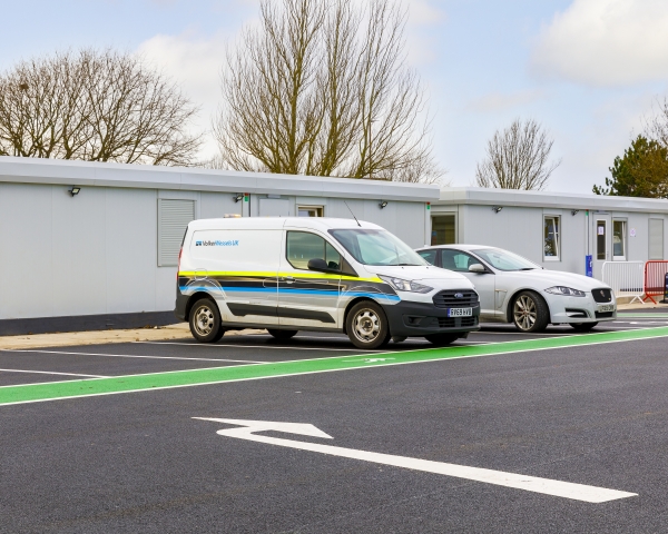 Site cabins with van parked outside
