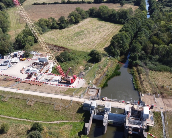Gate being installed by a crane