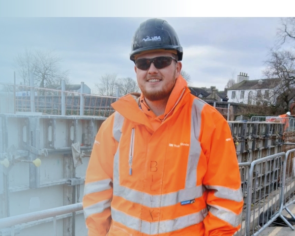 Picture of a man on site in high vis.