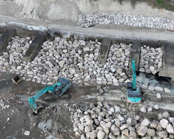 Picture of two diggers moving rocks.