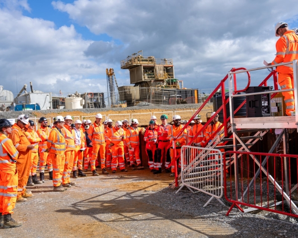 Men stood around a rig.