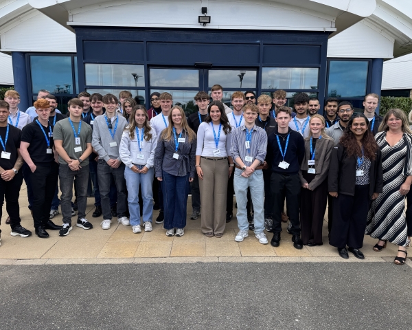 graduates and apprentices outside the office.