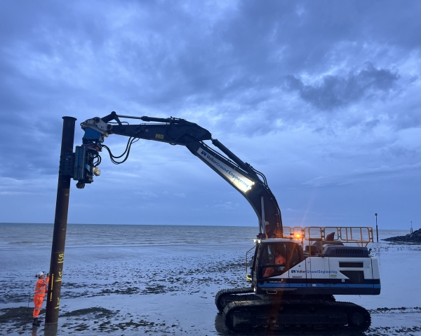 Piling rig installing piles