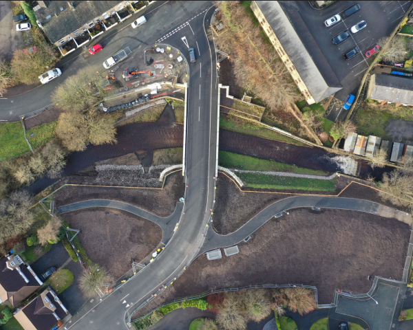 New 21m span bridge following rewidening of river and removal of existing bridge and footbridge.png