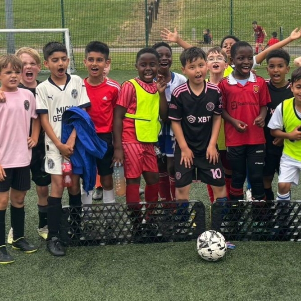 Picture of children playing football.