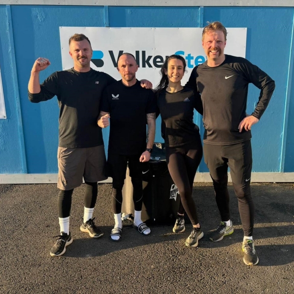 Picture of three men and a girl after a run.
