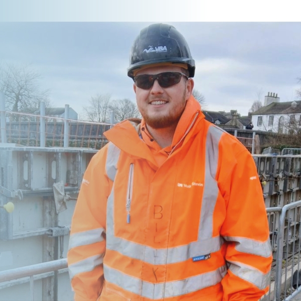 Picture of a man on site in high vis.