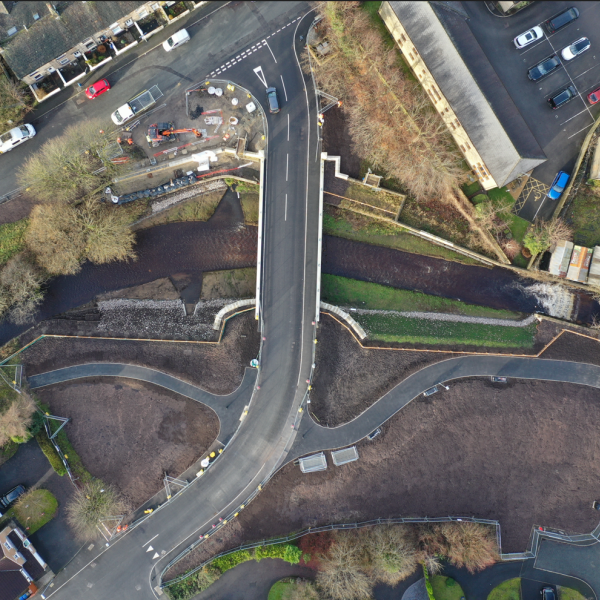 New 21m span bridge following rewidening of river and removal of existing bridge and footbridge.png
