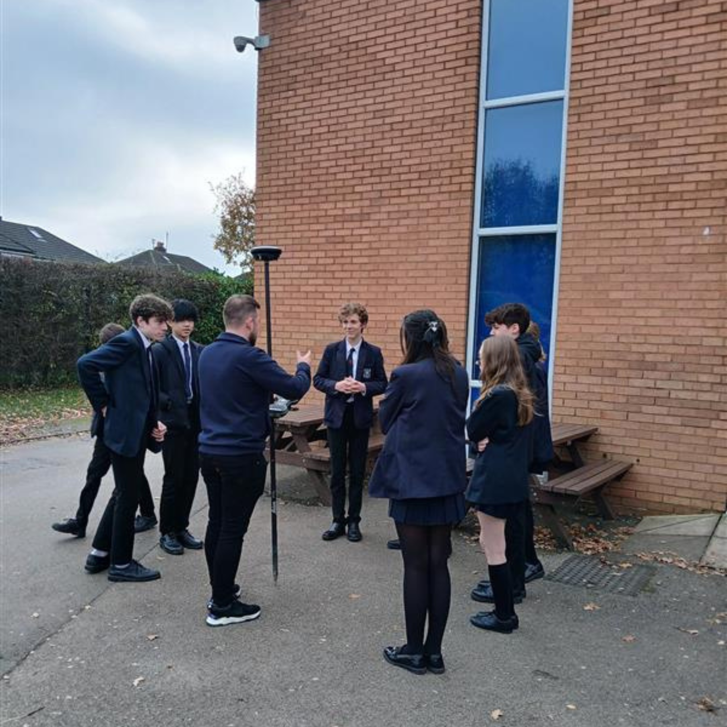 Students stood around a pole
