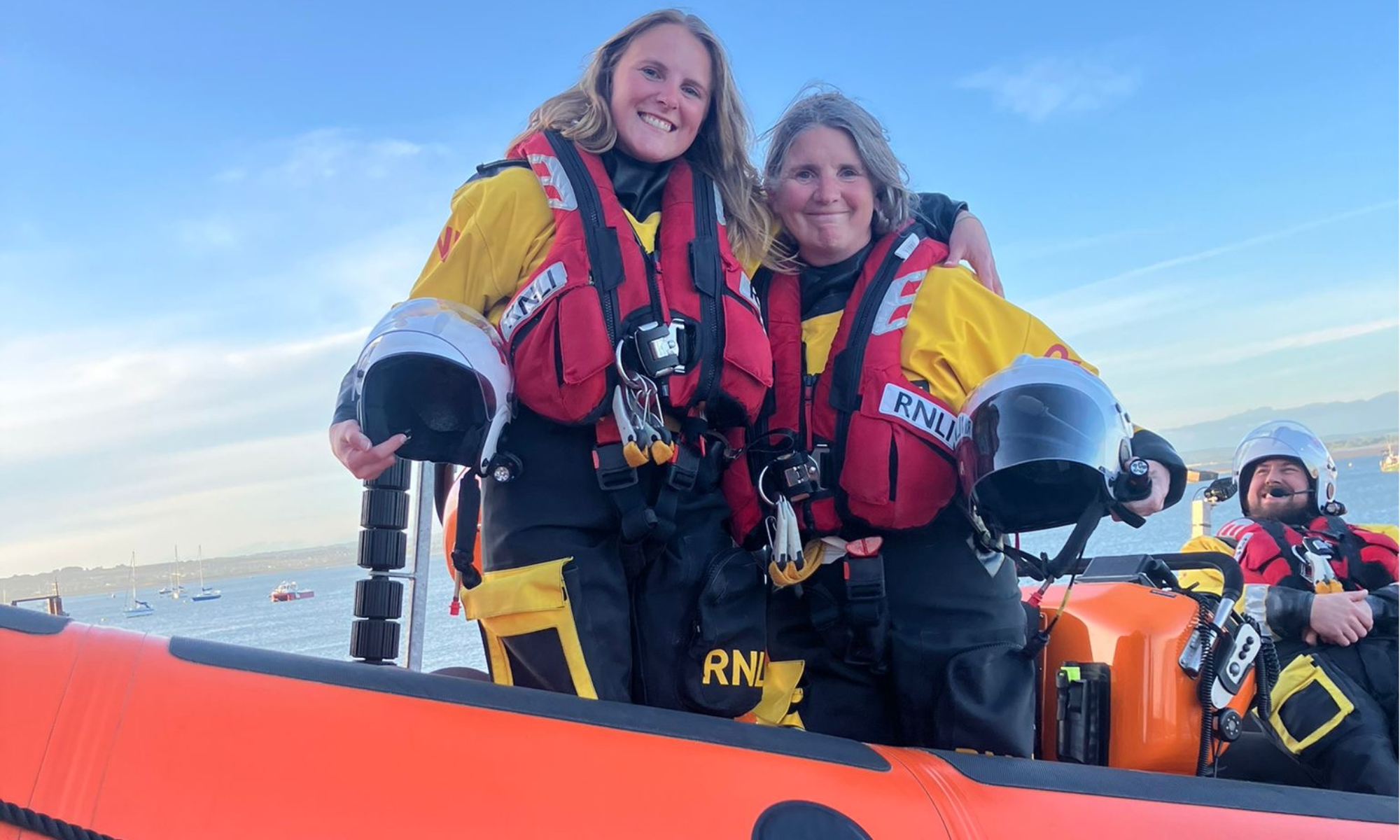 Two girls on a lifeboat.