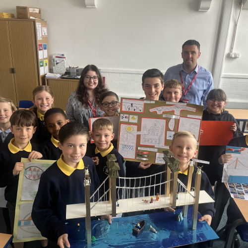 Children in a classroom with model bridges