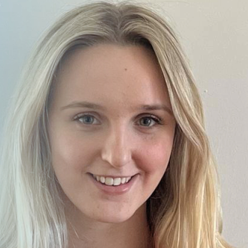 Picture of blonde girl smiling at the camera.