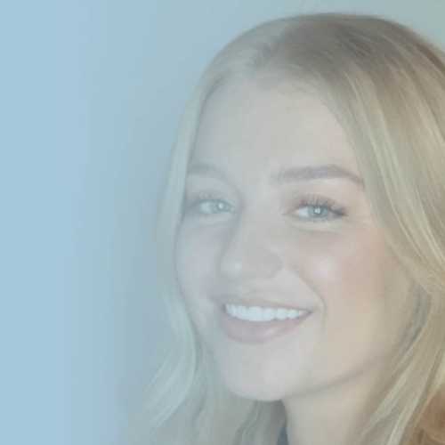 Girl with blonde hair smiling.