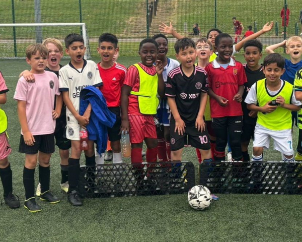 Picture of children playing football.