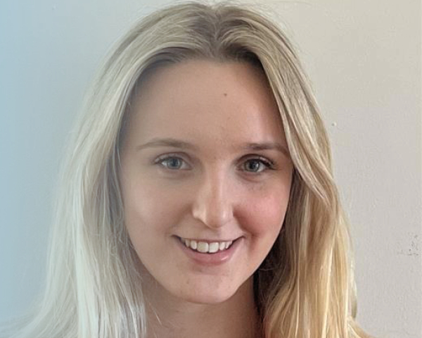 Picture of blonde girl smiling at the camera.