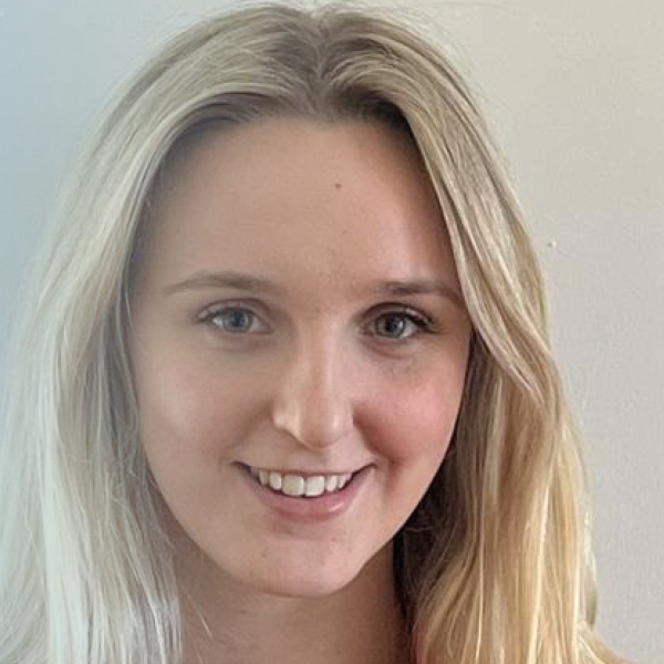 Picture of blonde girl smiling at the camera.