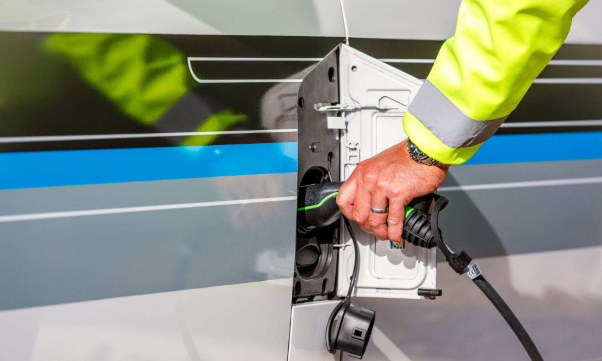 Electric charge point on a car